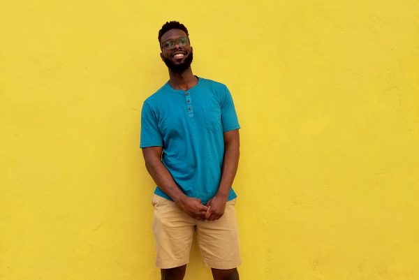 Henry Gilliard in front of a yellow wall