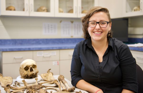 Sara Juengst in her lab with bones from the teaching collection