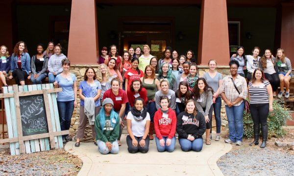 Group of female students in front of a building