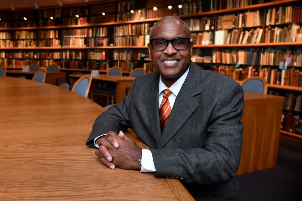 Jeffrey Leak at table in library