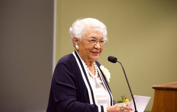 Bertha Maxwell-Roddey speaks at a podium