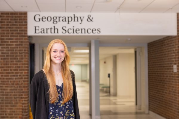 Mckenna Zelna stands outside her department.