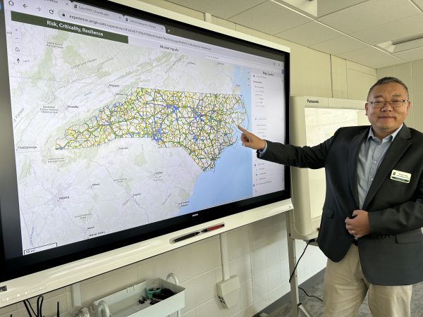 Tang points to a map of North Carolina on the Geo-FRIT dashboard.