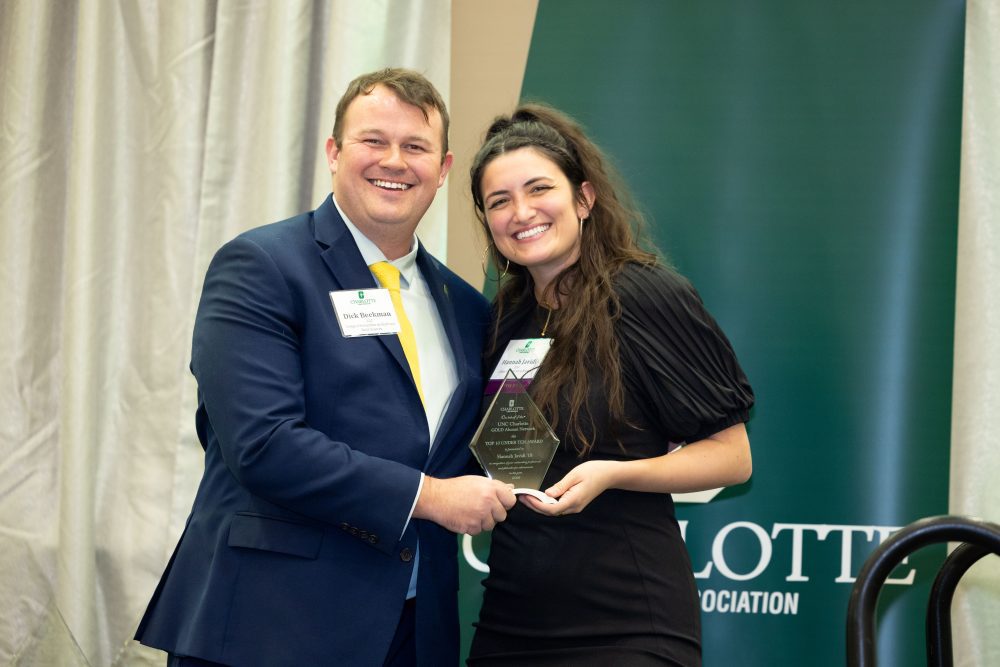 Dick Beekman and Hannah Javidi on stage with Javidi's award
