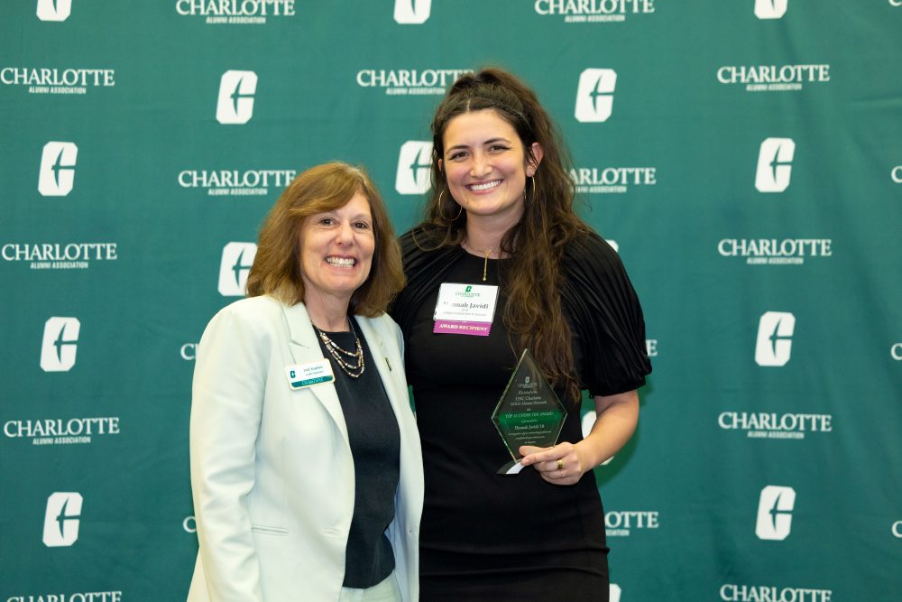 Jodu Kaplan and Hannah Javidi pose with Javidi's award
