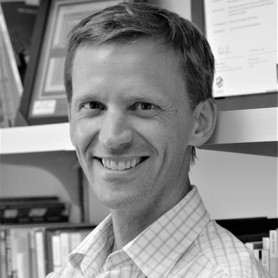 Headshot of Jason Giersch in black and white