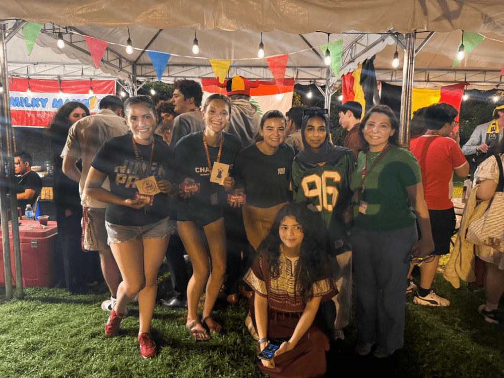 Al-Shamat and students pose for a group photo in the Global Village in Manila.