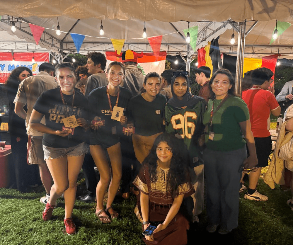 Al-Shamat and students pose for a group photo in the Global Village in Manila.