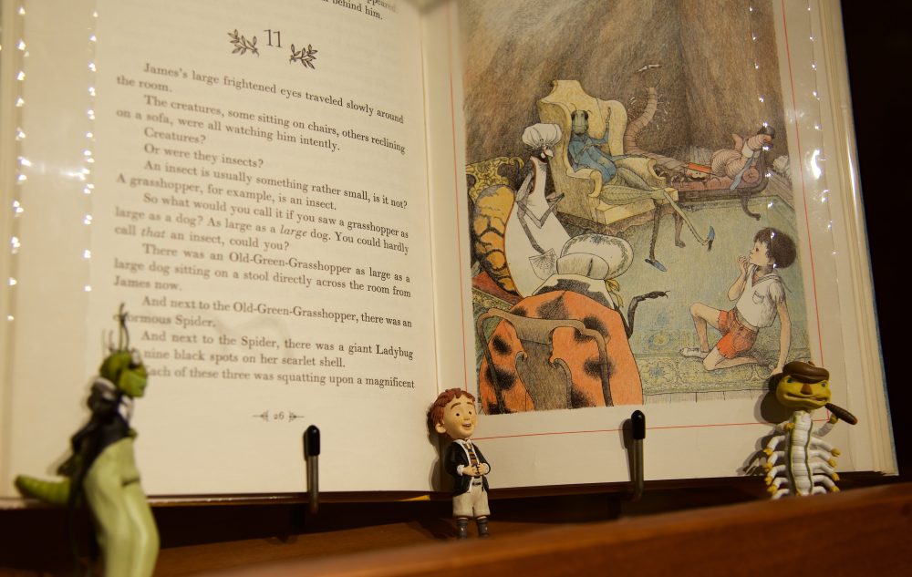 Close up shot of "James and the Giant Peach" with a small figurine of a child