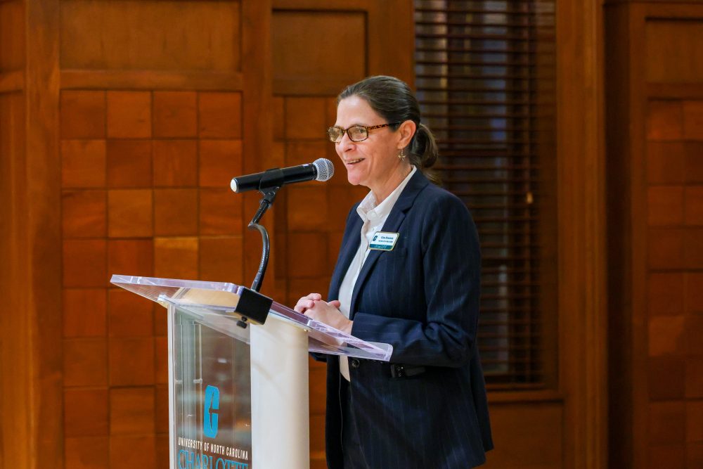 Regina Branton, the Rauch Distinguished Professor of Political Science, speaks at the podium.