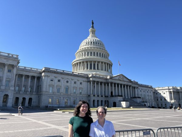 Maddison Elliott and Karen Flint standing in front of the U.S. Capitol building in Washington, D.C. for the 2026 National Humanities Alliance Meeting.