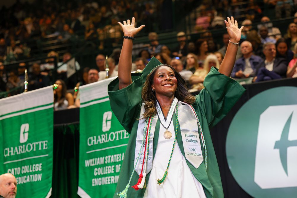 UNC Charlotte graduate Kennedy Frink crosses the stage.