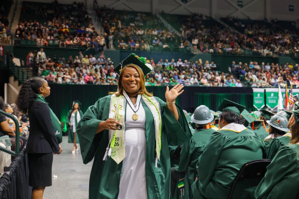 Shykera Spencer waves to the crowd