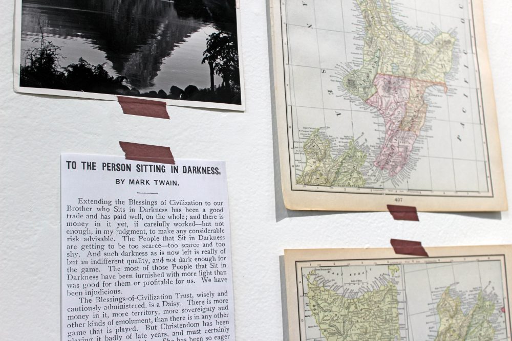 Close up of a paper taped on the wall that contains the text of Mark Twain's "To the Person Sitting in Darkness."