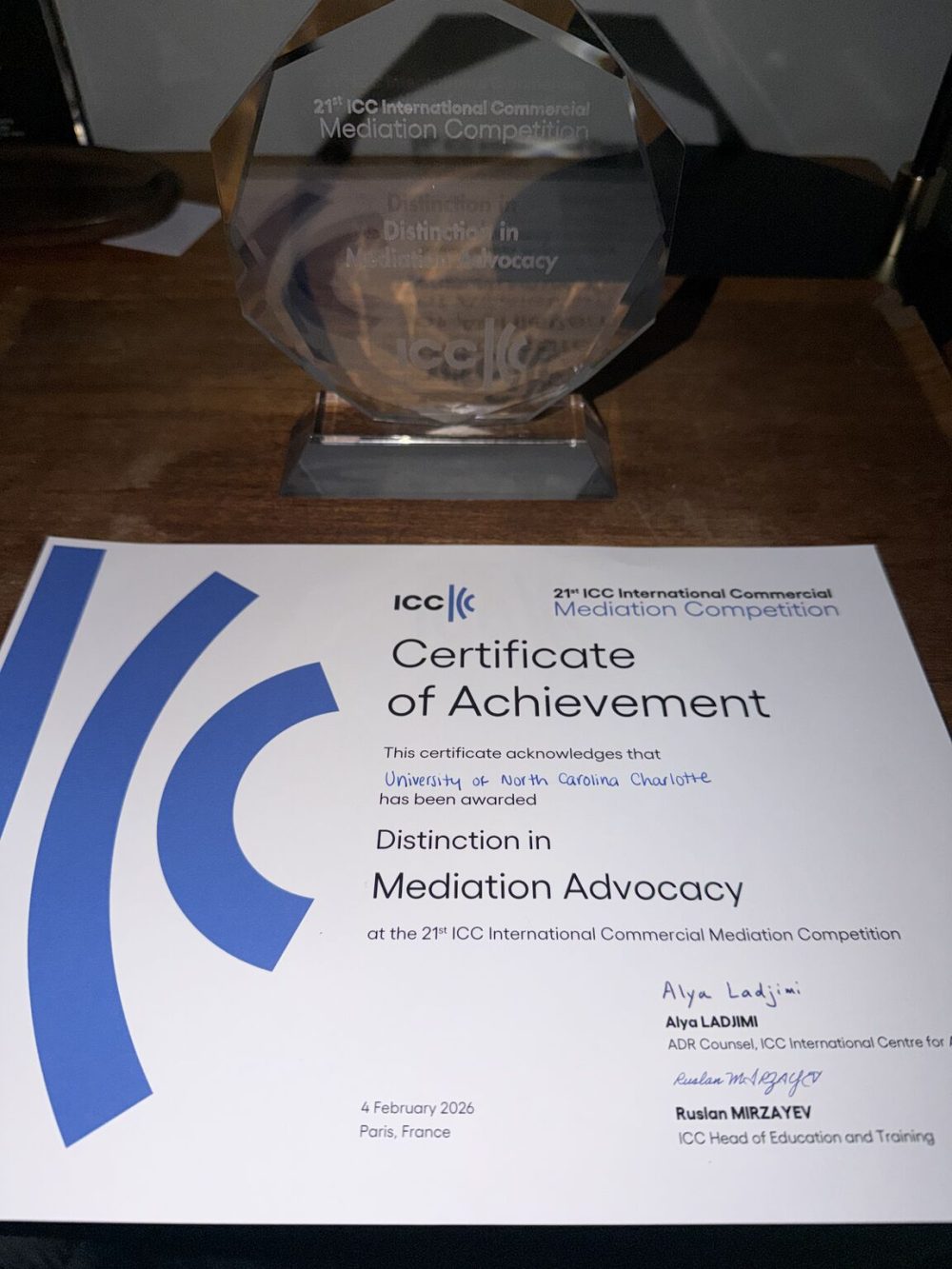 The ICC certificate of achievement for the University of North Carolina at Charlotte and the glass award for Distinction in Mediation Advocacy.