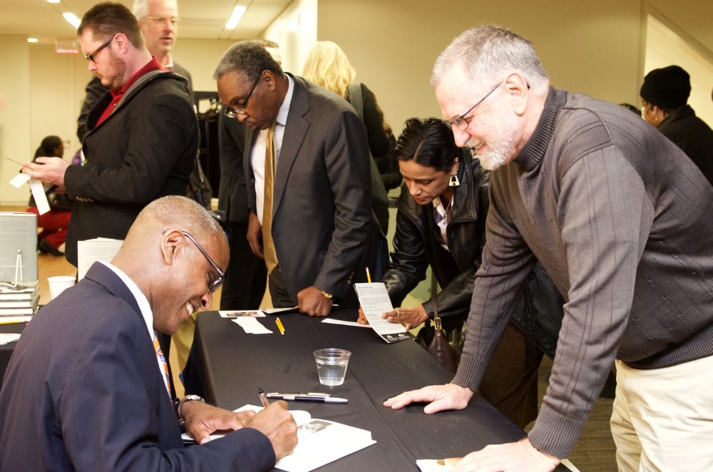 Jeffrey Leak signs his book after his Personally Speaking lecture.