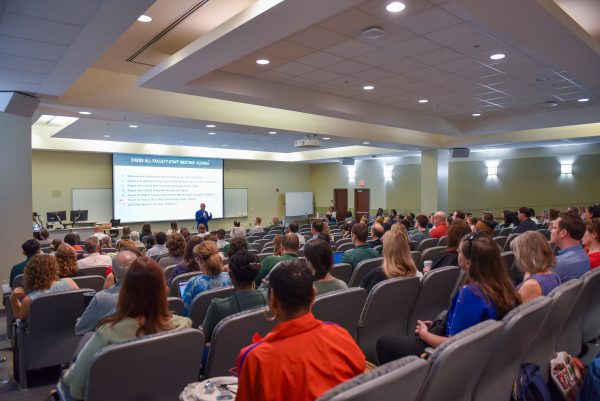 Chris Boyer, dean of the UNC Charlotte College of Humanities & Earth and Social Sciences, speaks to CHESS faculty and staff at the kick-off meeting for the 2026-27 academic year.